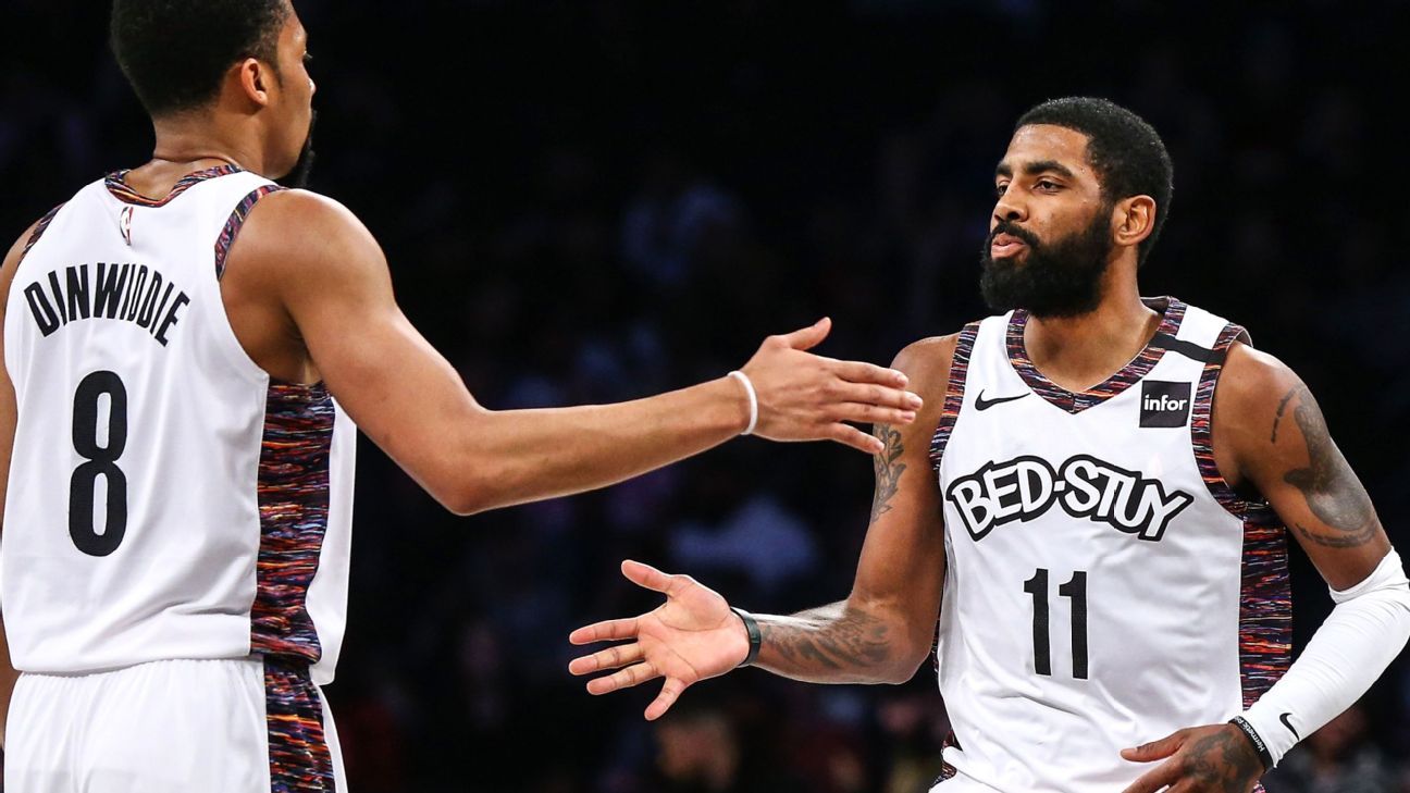 Kyrie signs Nets' jersey salvaged from fire for fan