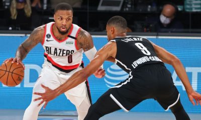 Dame, Blazers survive Nets to nab play-in berth