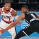 Dame, Blazers survive Nets to nab play-in berth