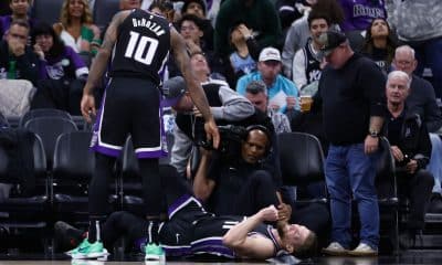 Kings' Sabonis cuts eye, returns, then rolls ankle