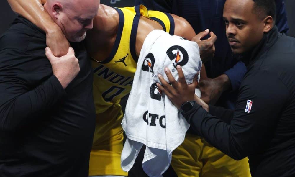 Emotional Haliburton helped off with Achilles injury