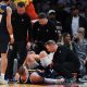 Nuggets' Jokic limps off court after injuring knee